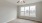 Oversized window in bedroom with ceiling fan and light fixture in homes at Lookout View Townhomes