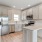 C-shaped kitchen with recessed lighting in townhomes at Lookout View