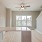 Modern kitchen facing living area with ceiling fan and light fixtures at Lookout View Townhomes