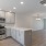 Spacious kitchen with breakfast bar in homes at Lookout View Townhomes