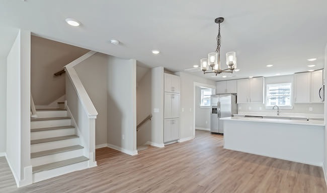Modern Interiors First floor living area open to modern kitchen in townhome at Lookout View Townhome